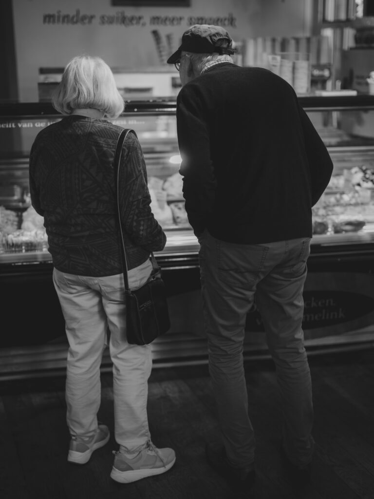 aging parents looking at a bakery case