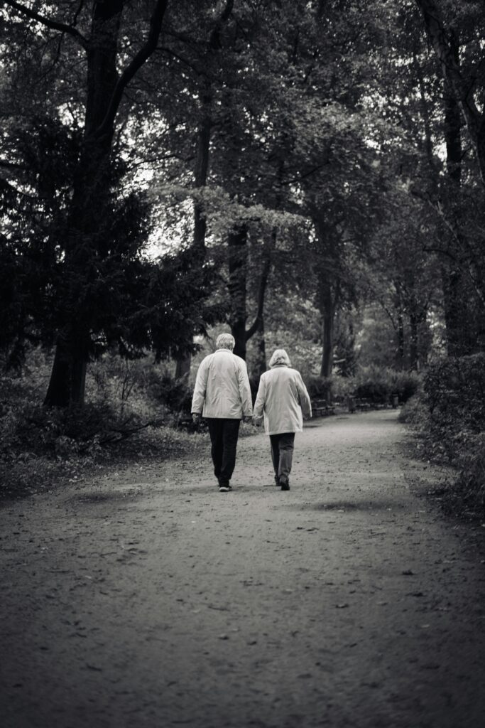 aging parents out for a walk holding hands