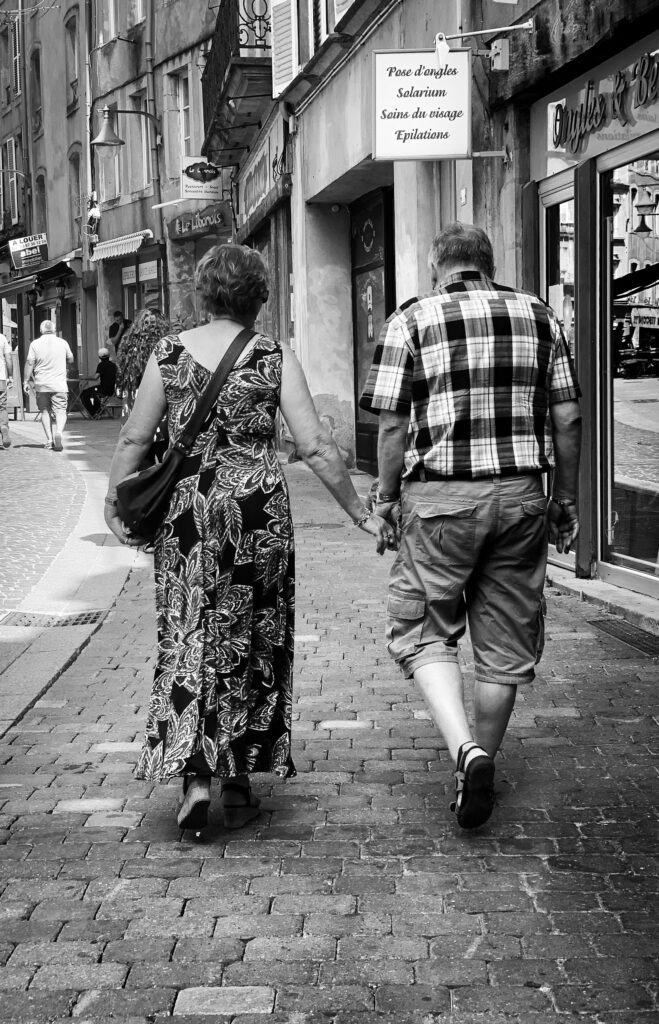 aging parents walking down a street
