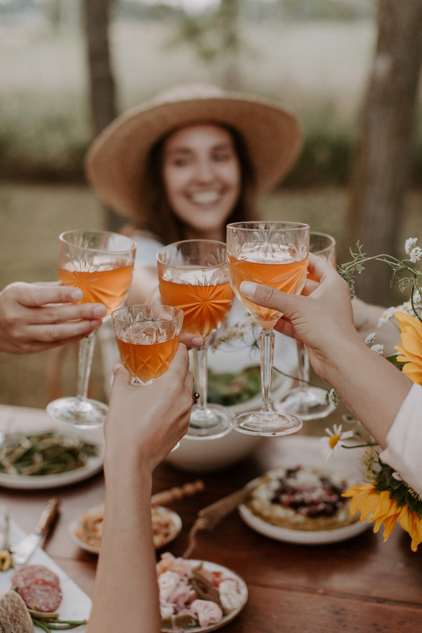 women with rose wine cheering